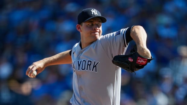 Oct 1, 2023; Kansas City, Missouri, USA; New York Yankees starting pitcher Michael King (34) pitches during the first inning at Kauffman Stadium. Mandatory Credit: Jay Biggerstaff-USA TODAY Sports  